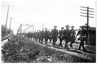World War I soldiers crossing the bridge